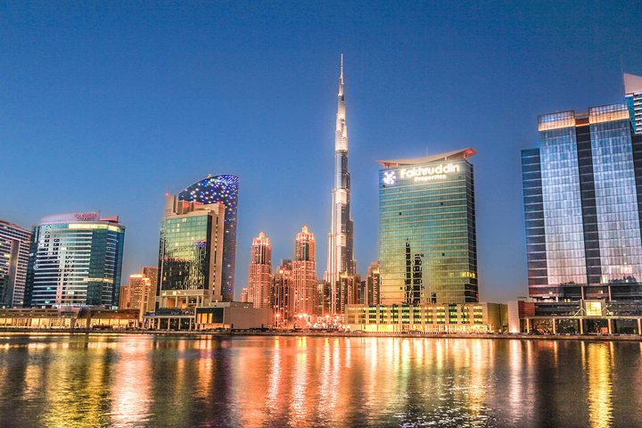Experience the breathtaking skyline of Dubai where the iconic Burj Khalifa reflects shimmering lights over tranquil waters blending modern marvels with timeless charm in every view.